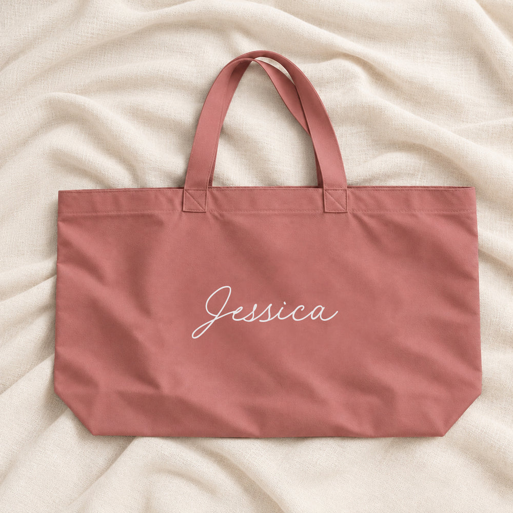 Dusty rose pink personalised bridesmaid XL tote bag with the name Jessica in script, on ivory linen