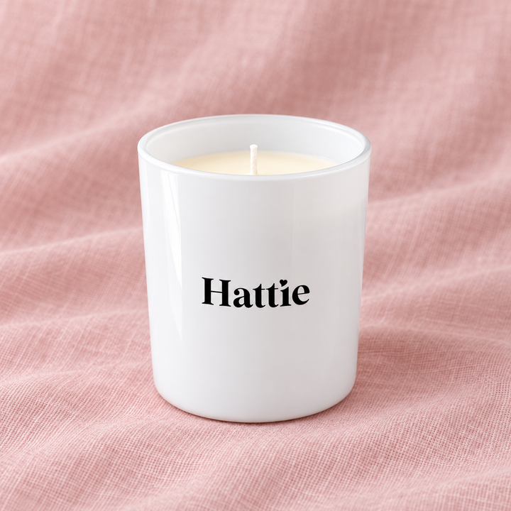 Glossy white personalised bridesmaid candle jar with the name Hattie