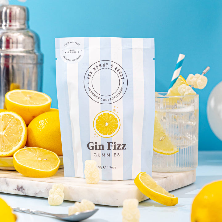 Gin Fizz gummies packaging with lemons and a cocktail on a blue background