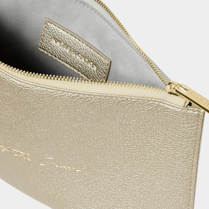 Gold clutch bag with a gold zipper on a white background