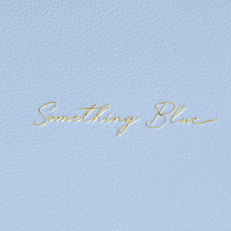 Light blue fabric with 'Something Blue' embroidery in gold thread